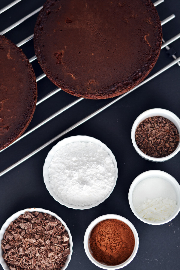 Baked cakes and chocolate ingredients for Triple Chocolate Cake